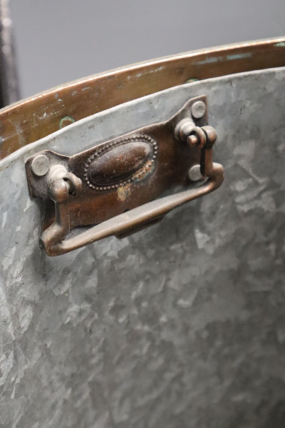 A Victorian copper and brass cylindrical coal box, with lion-mask ring handles, wood liner, 38cm